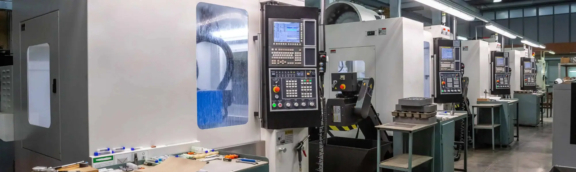 CNC machines lined up in a row