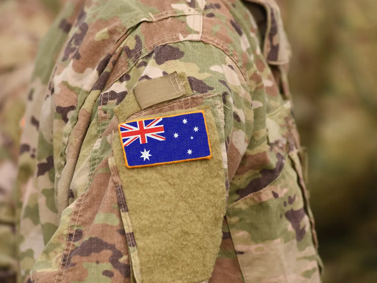 Australian soldier with Australian flag on his shoulder