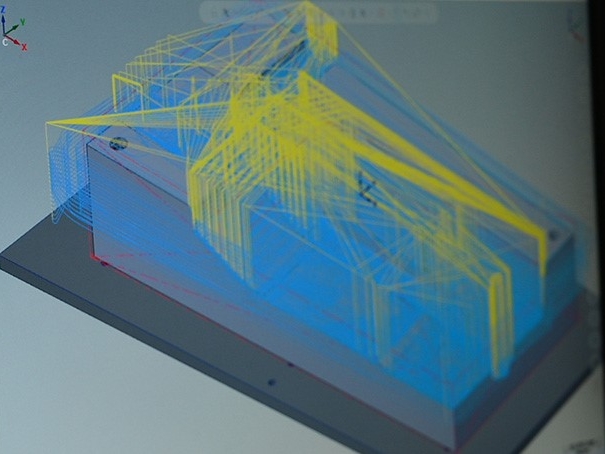 CAD Software with blue model on screen