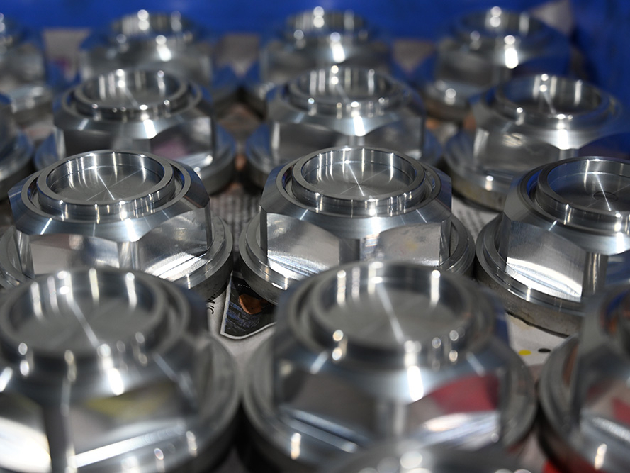 Multiple CNC machined metal products in a row