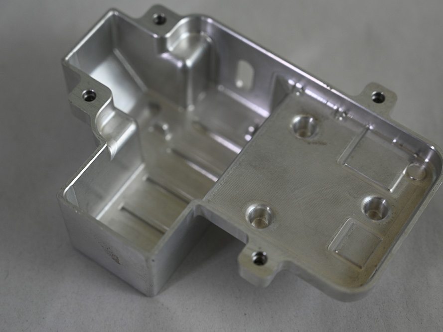 Small CNC machined metal product from behind